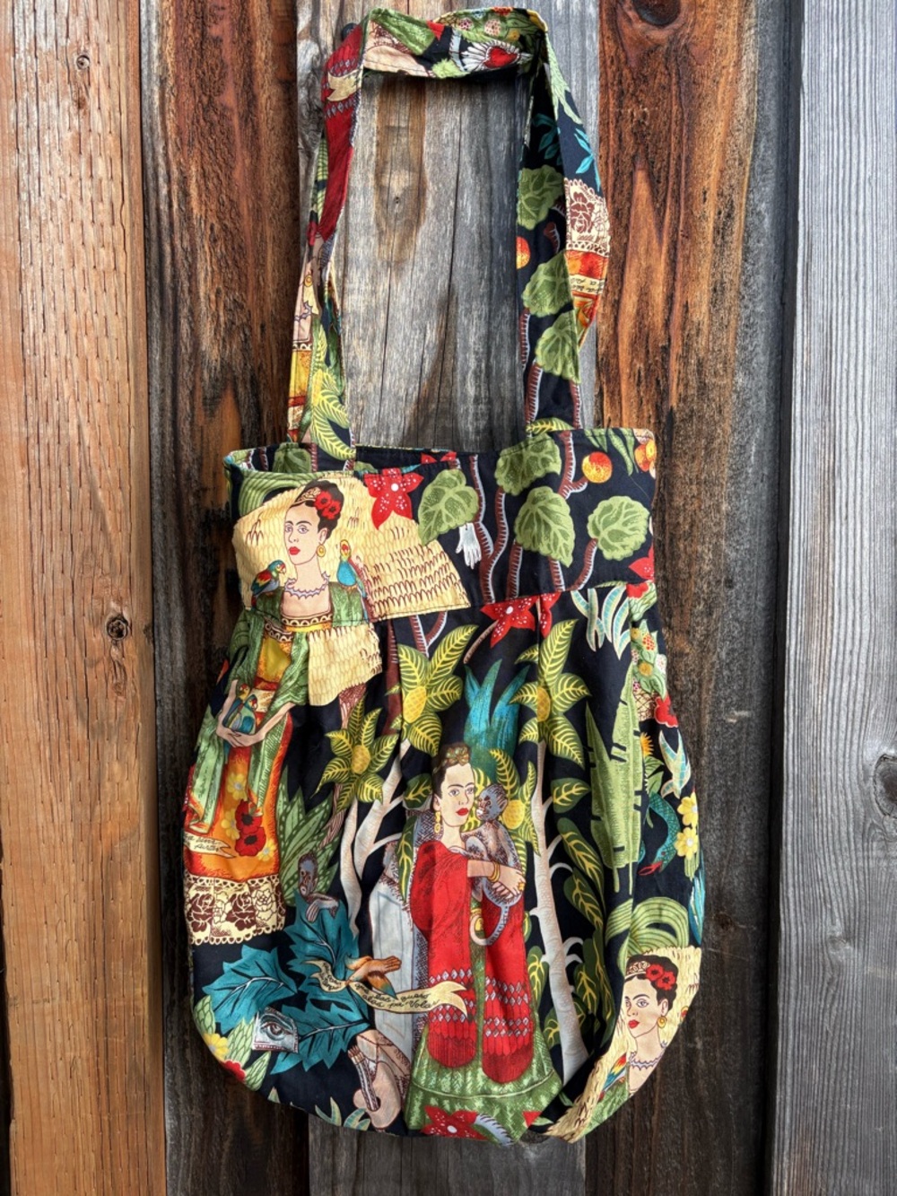 Purse tote bag featuring a "Frida's Garden" print by Alexander Henry Fabrics.